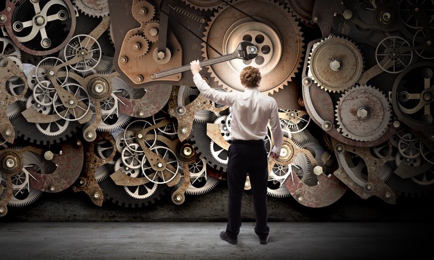 man interacting with gears